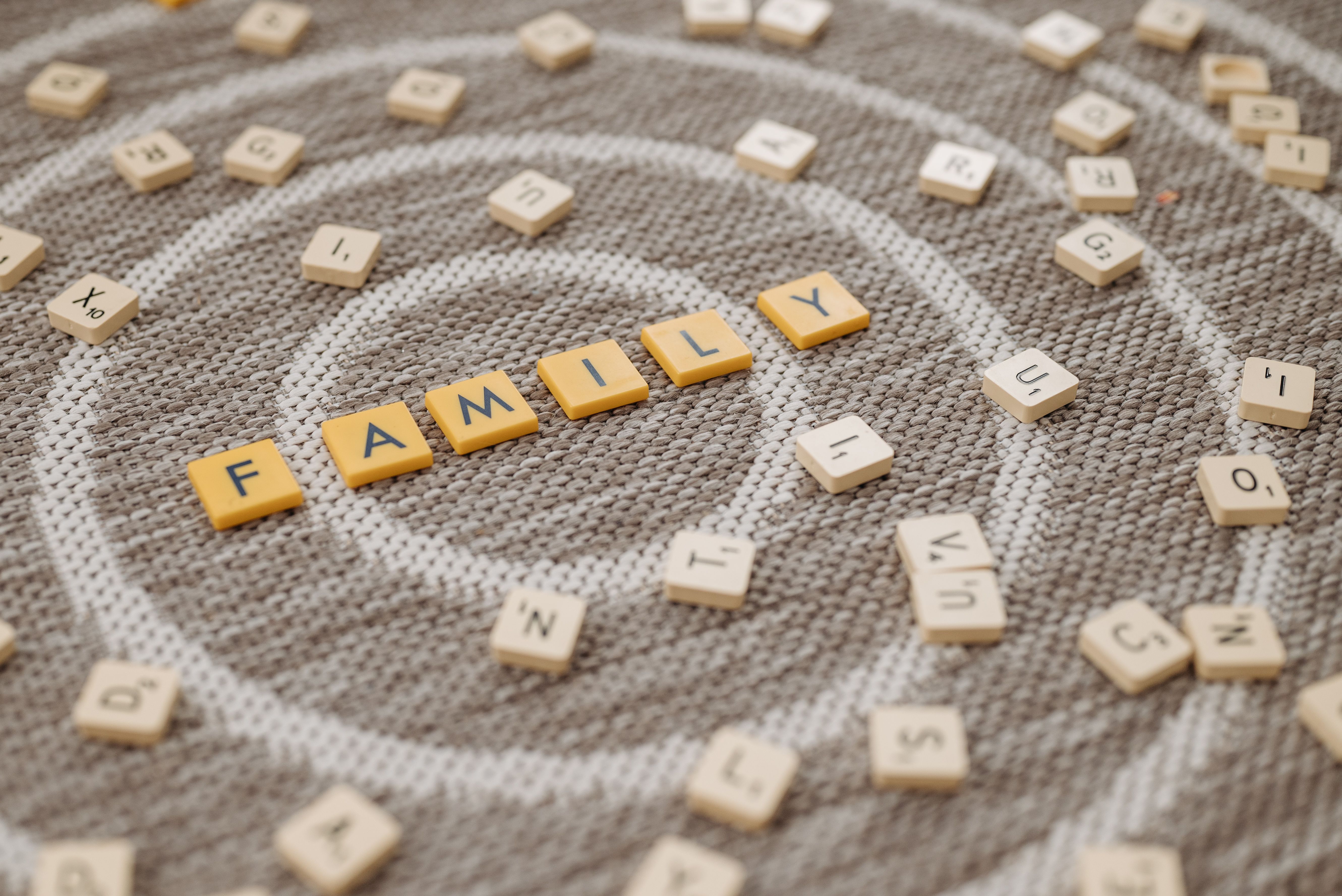 Scrabble tiles that spell out family